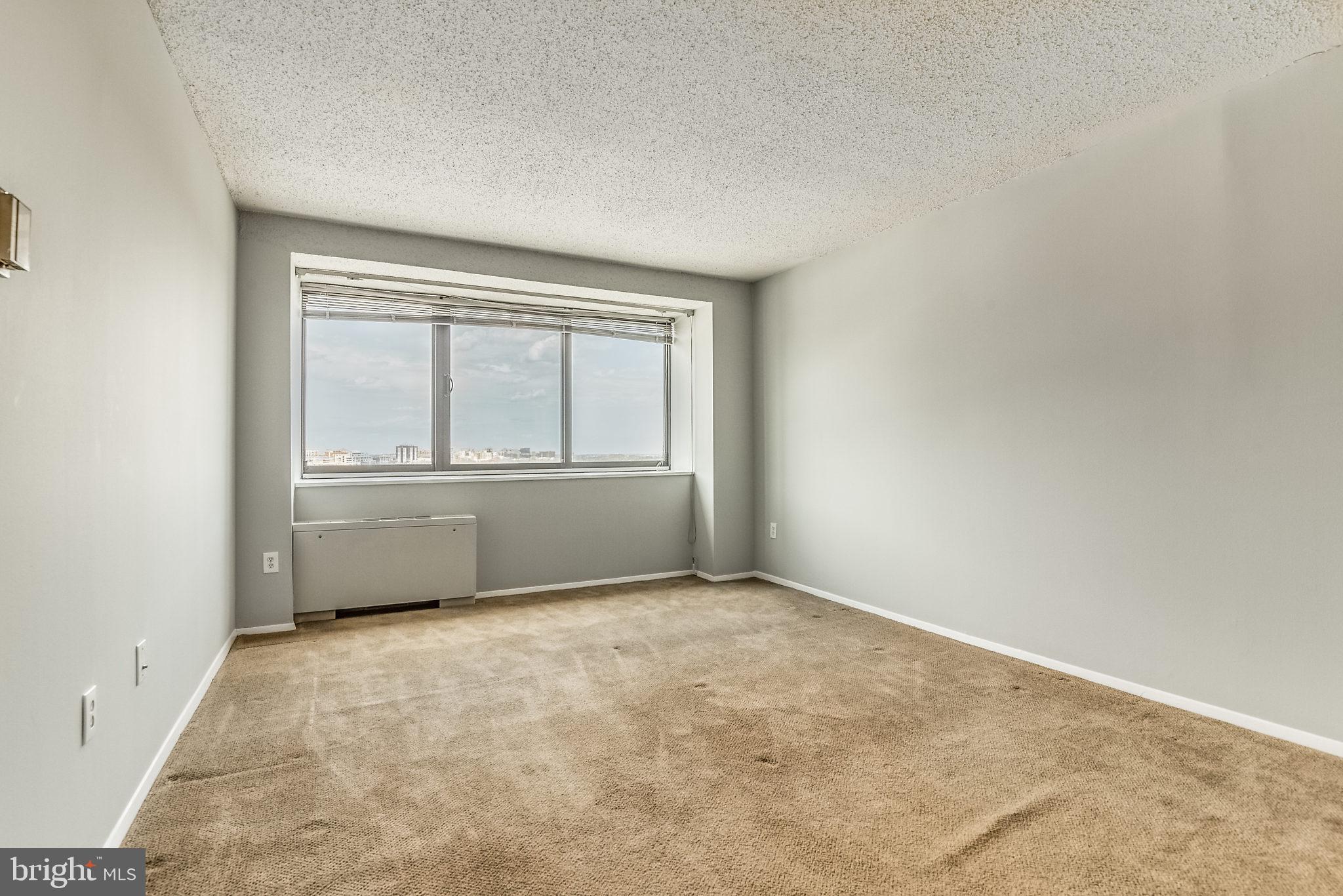 4141 North Henderson Road, Unit 1019 Arlington, VA 22203 - Photo 10 of 27 Spacious room with panoramic city views.