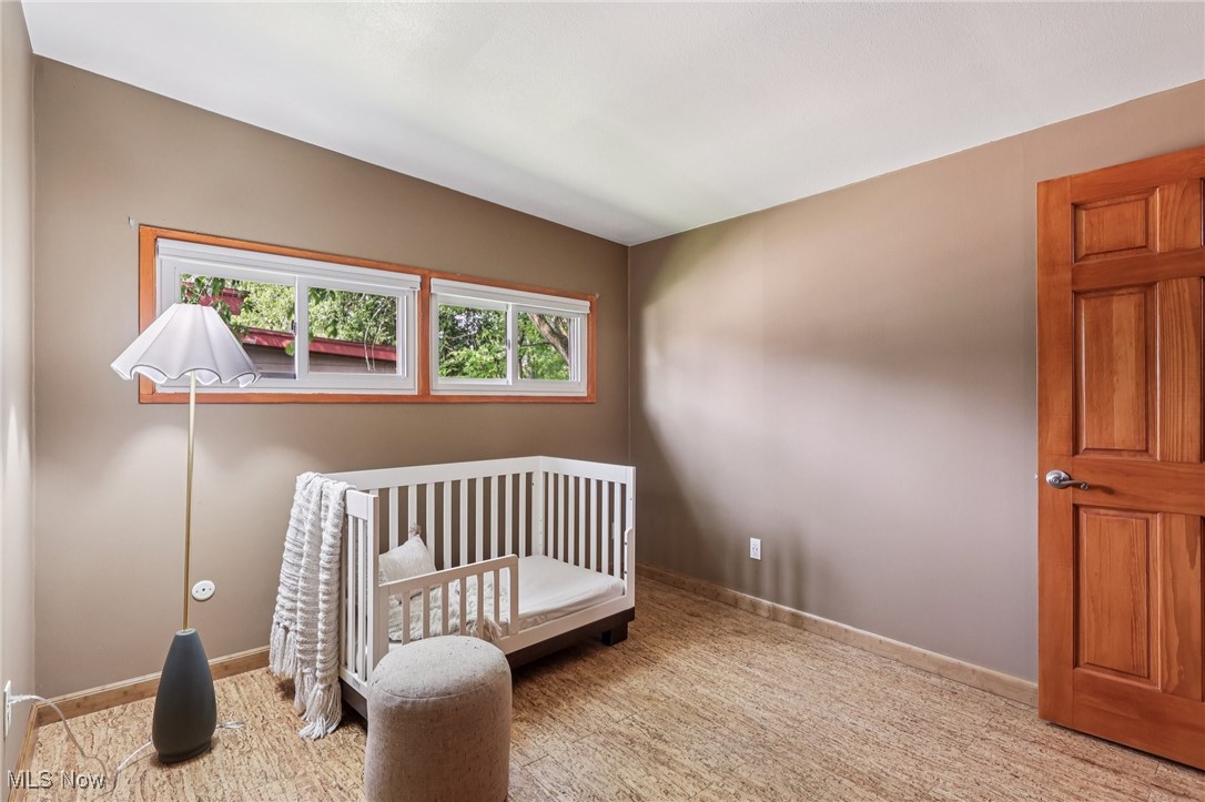 6568 Sherborn Road Parma Heights, OH 44130 - Photo 24 of 47 Bedroom with carpet flooring, a crib, and baseboards