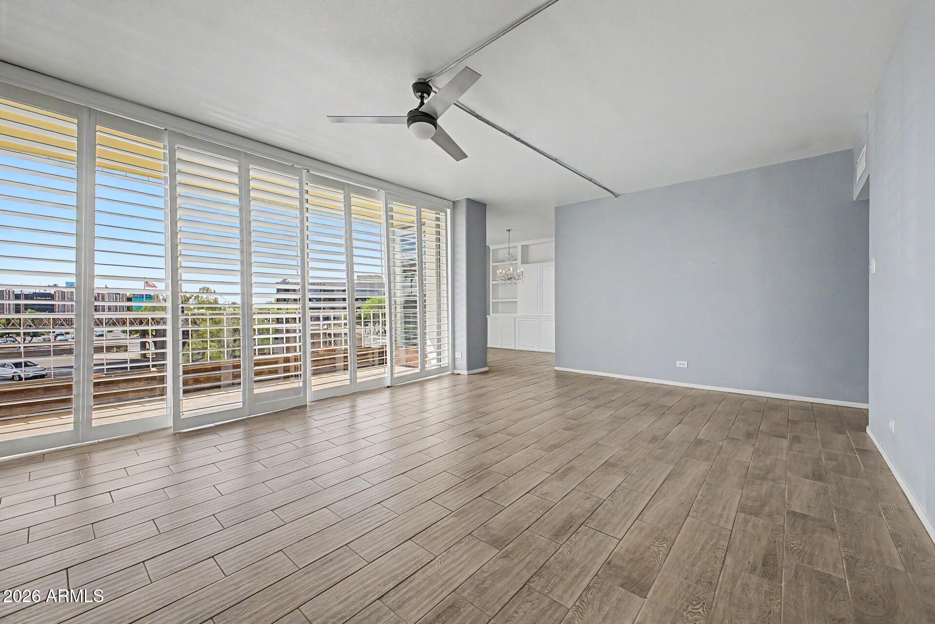 207 West Clarendon Avenue, Unit B2 Phoenix, AZ 85013 - Photo 3 of 30 a view of empty room with wooden floor and fan