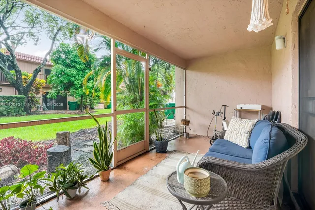 a living room with furniture and a swimming pool