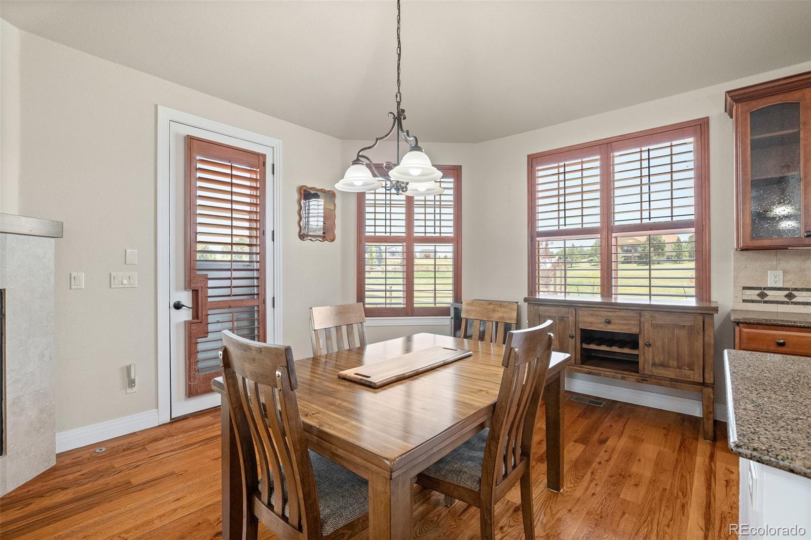 41865 East Muirfield Loop Elizabeth, CO 80107 - Photo 16 of 50 a dining room with furniture window wooden floor
