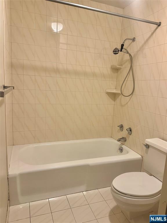 6 Horizon Road, Unit 1204 Fort Lee, NJ 07024 - Photo 12 of 19 a bathroom with a toilet and a bath tub