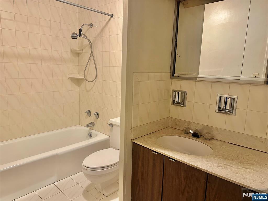 6 Horizon Road, Unit 1204 Fort Lee, NJ 07024 - Photo 15 of 19 a bathroom with a sink a toilet and shower