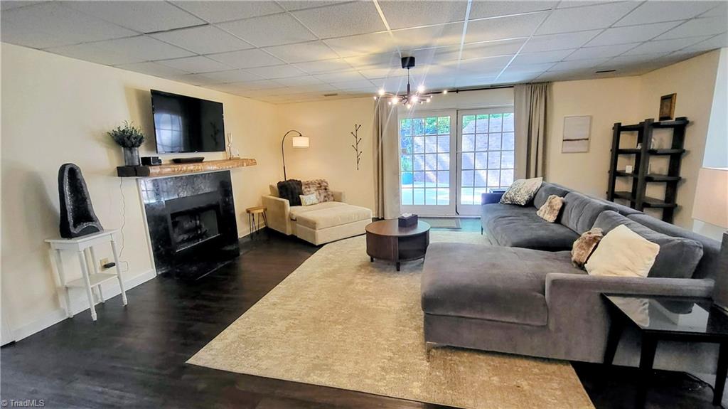 7035 Skylark Road Pfafftown, NC 27040 - Photo 25 of 47 Light-Filled Lower-Level Den Opening to a Private Patio Retreat!