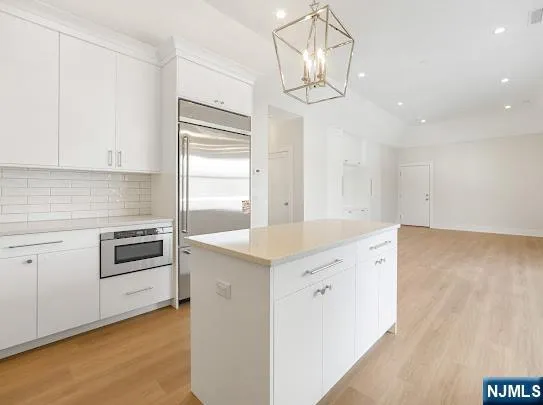 a kitchen that has a cabinets counter space and appliances