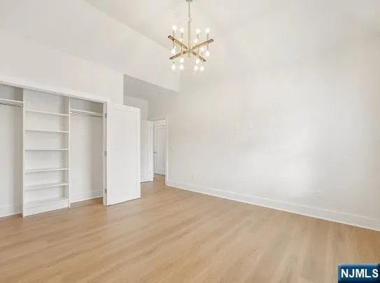 a view of an empty room with a ceiling fan