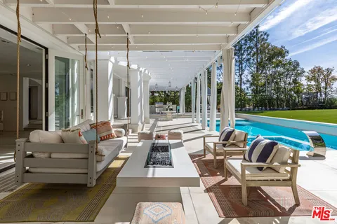 a outdoor living space with furniture and city view