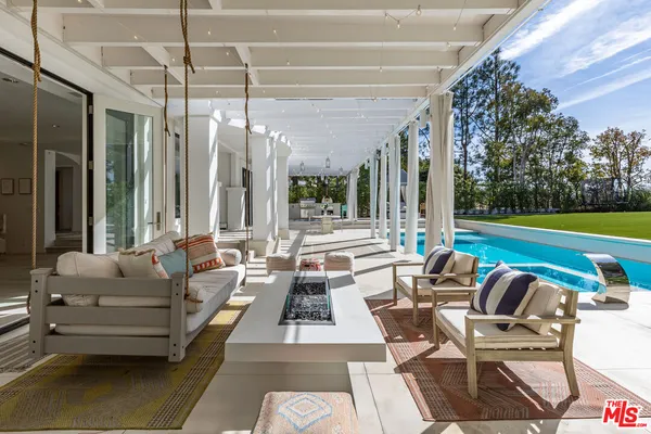 a outdoor living space with furniture and city view