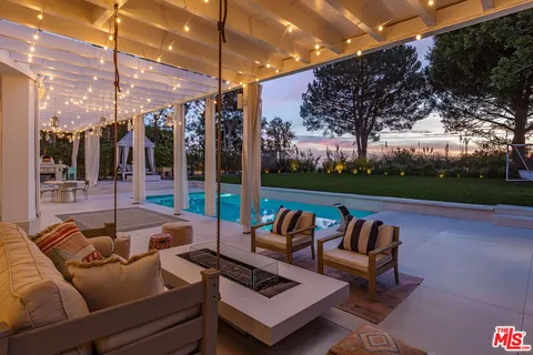 a view of swimming pool with chairs