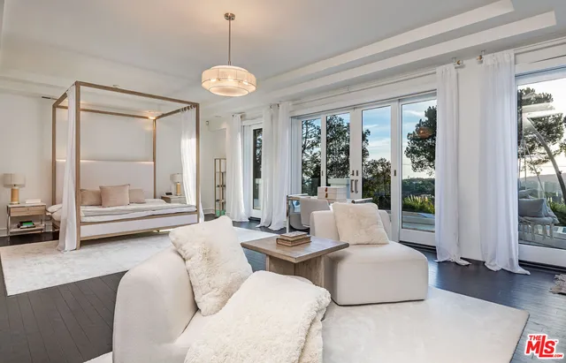 a living room with fireplace furniture and a flat screen tv