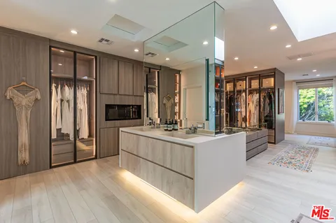 a bedroom with a bed a table and chair