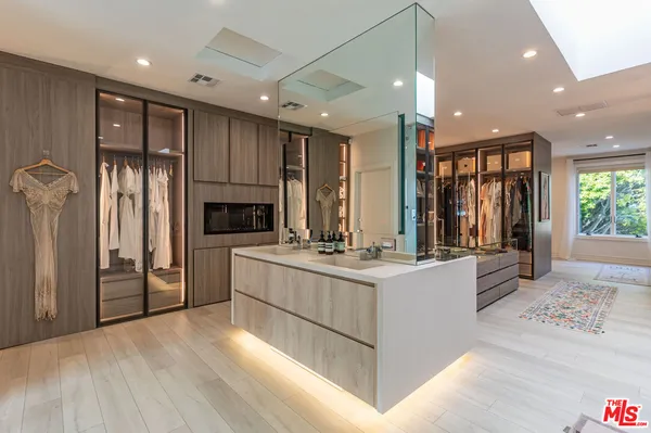 a bedroom with a bed a table and chair