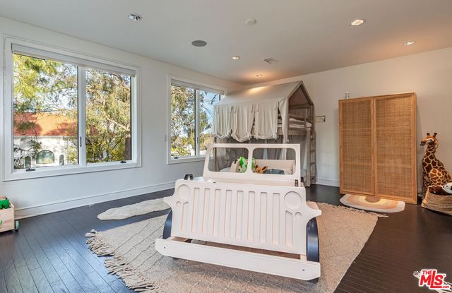swimming pool view with a garden space