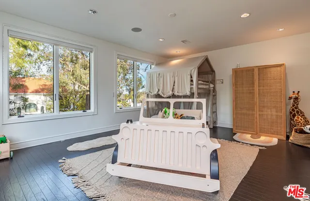 swimming pool view with a garden space