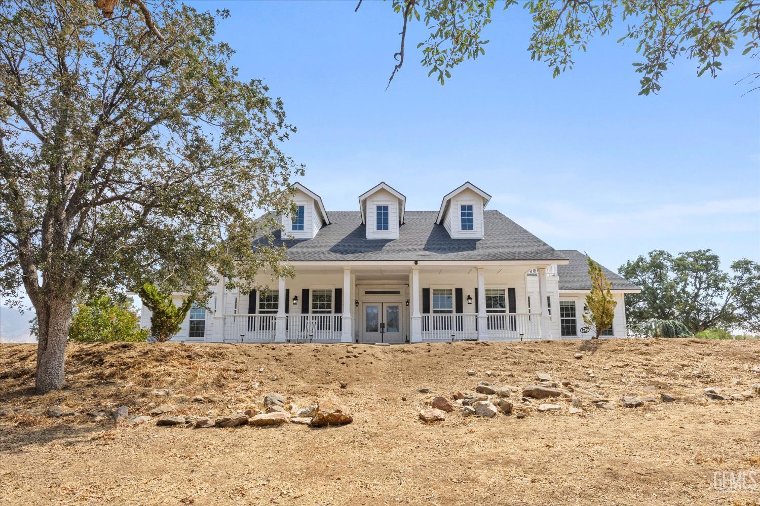 Undisclosed Address Caliente, CA 93518 - Photo 11 of 73 a front view of a house with a yard