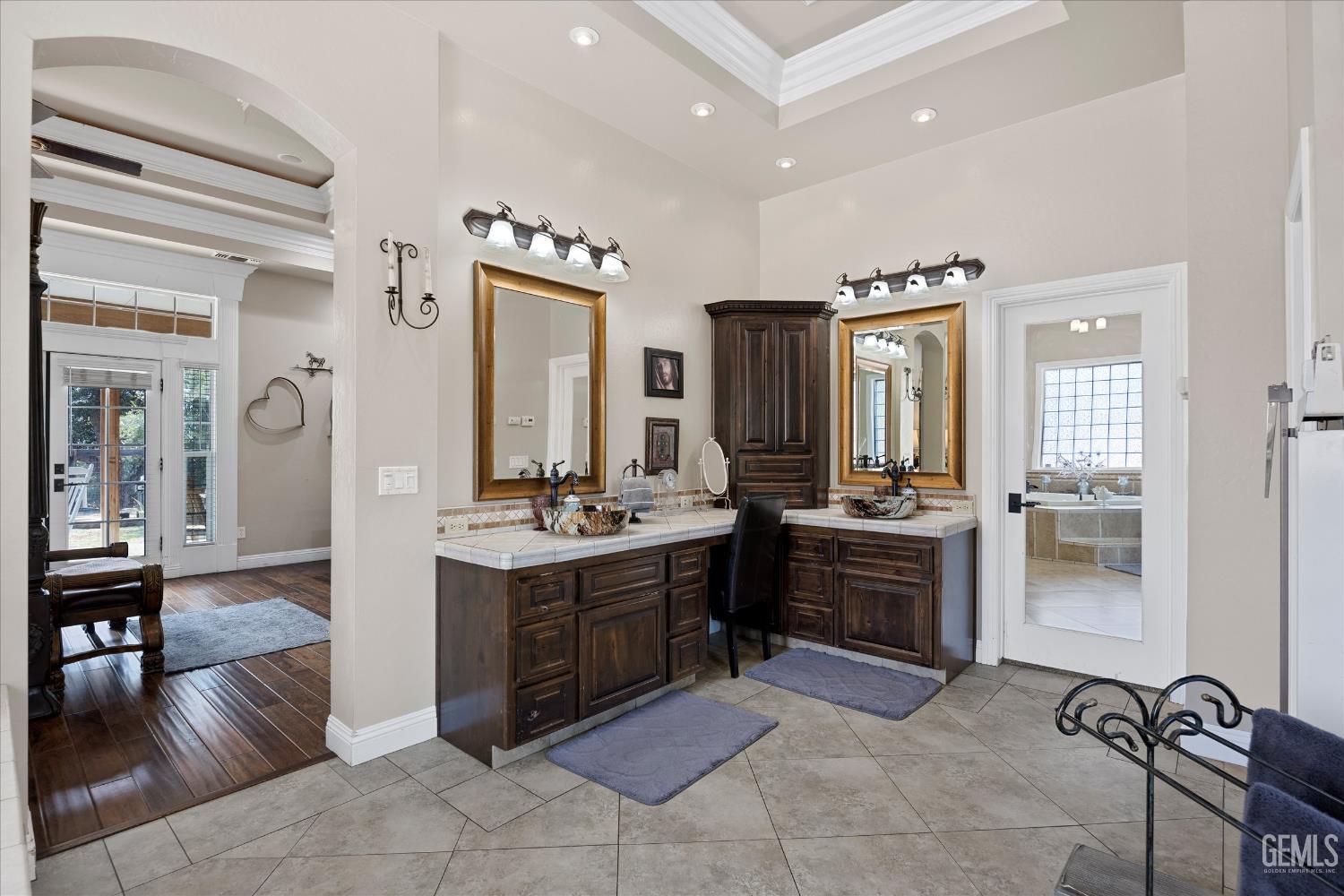 Undisclosed Address Caliente, CA 93518 - Photo 49 of 73 a large bathroom with a double vanity sink a mirror and a shower