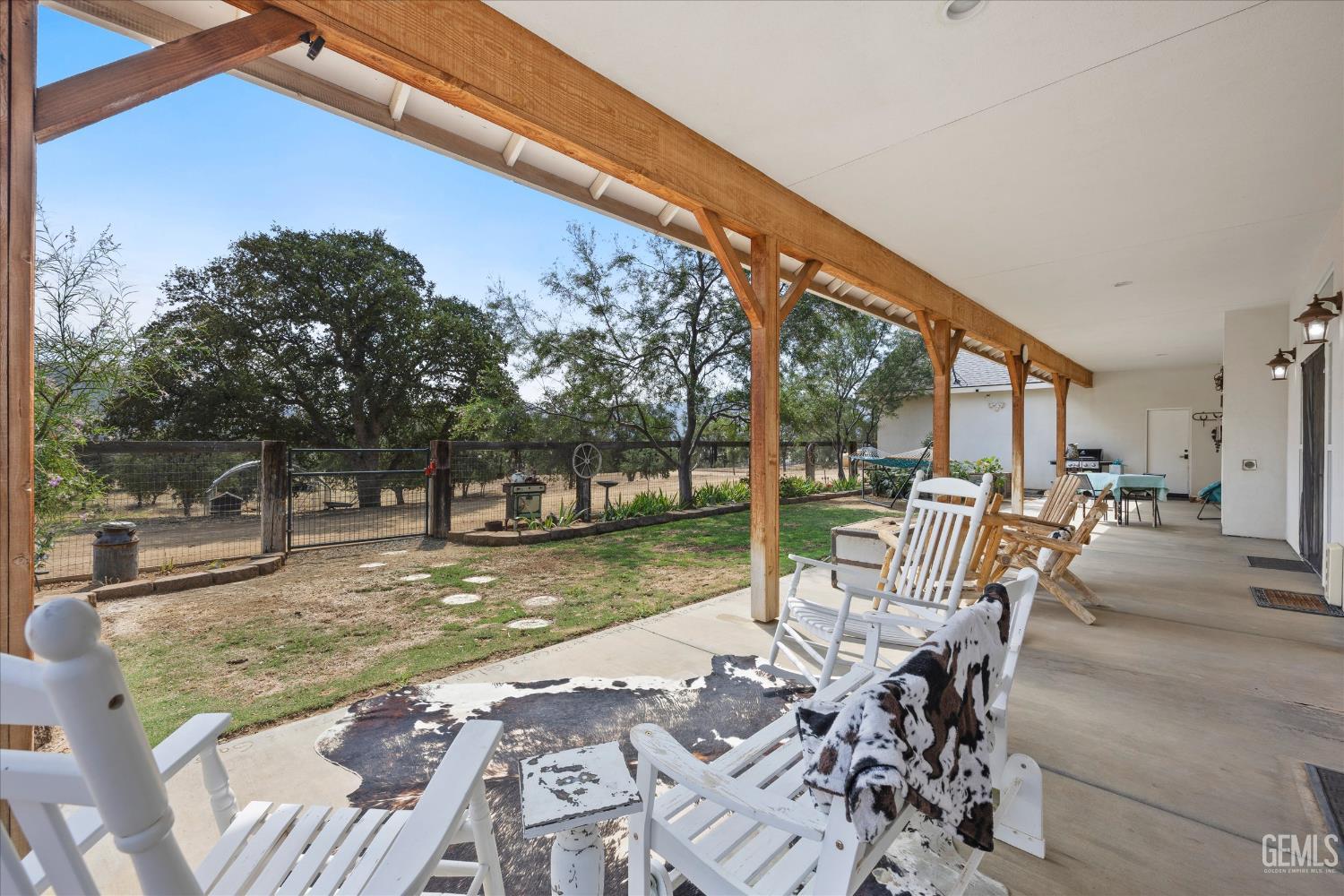 Undisclosed Address Caliente, CA 93518 - Photo 58 of 73 a view of a patio with a table chairs and a backyard