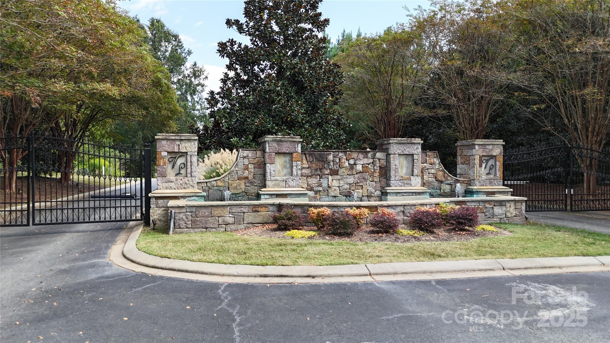 8335 Victoria Lake Drive Waxhaw, NC 28173 - Photo 3 of 8 a view of a house with a park