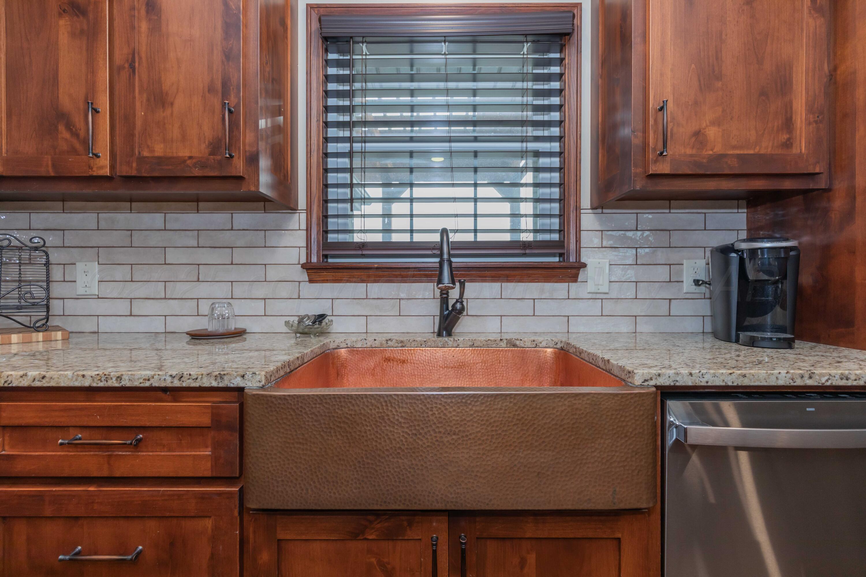 199 County Road BB Groom, TX 79039 - Photo 11 of 39 a kitchen with a sink and cabinets