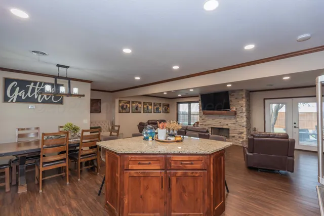 a living room with fireplace furniture and a flat screen tv