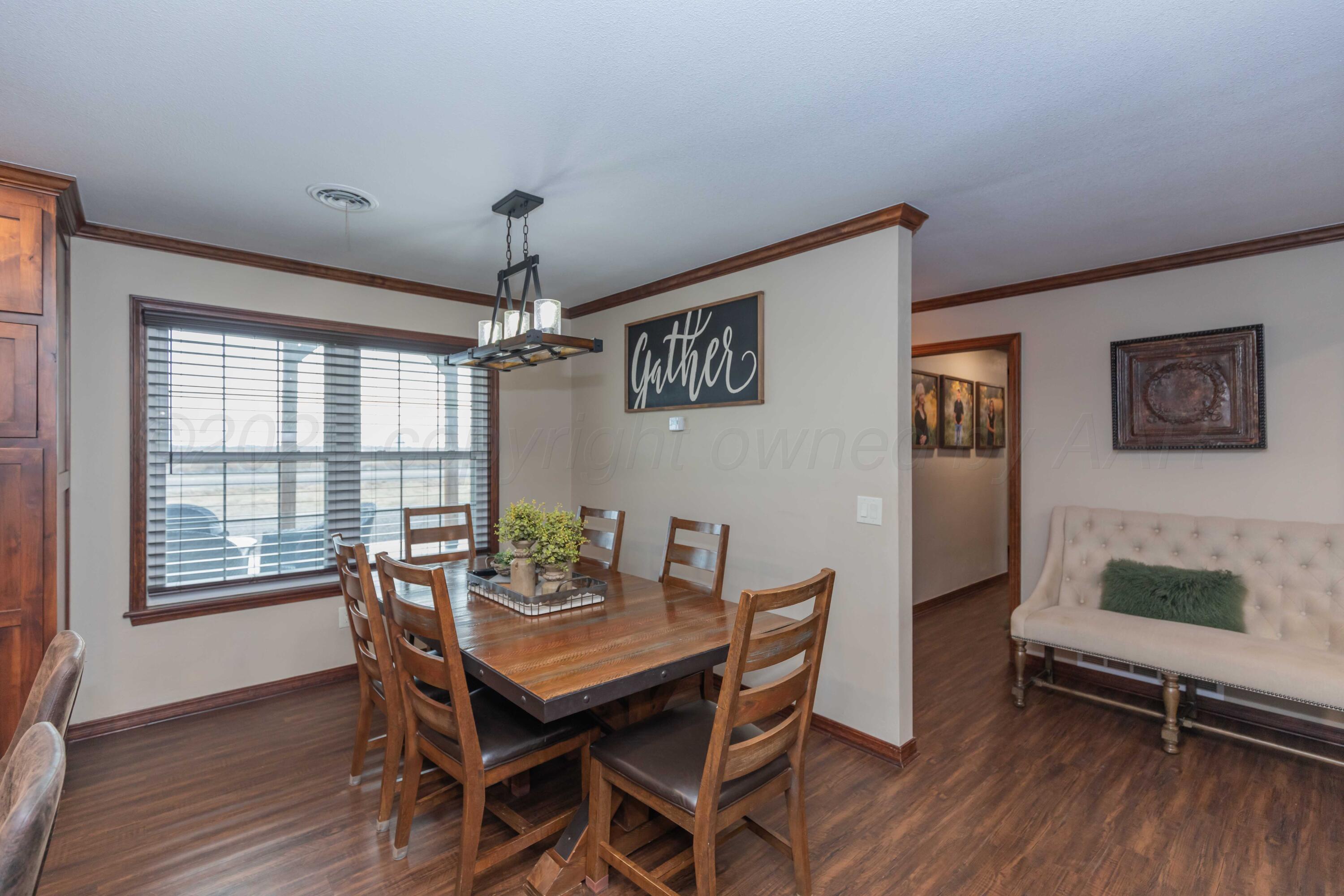 199 County Road BB Groom, TX 79039 - Photo 19 of 39 a view of a dining room with furniture window and wooden floor