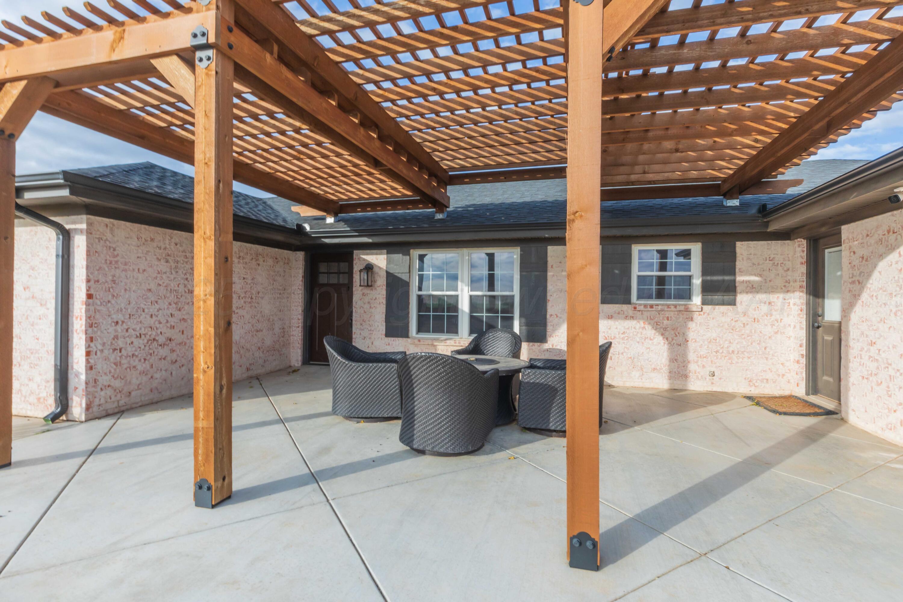 199 County Road BB Groom, TX 79039 - Photo 3 of 39 a view of a patio with table and chairs