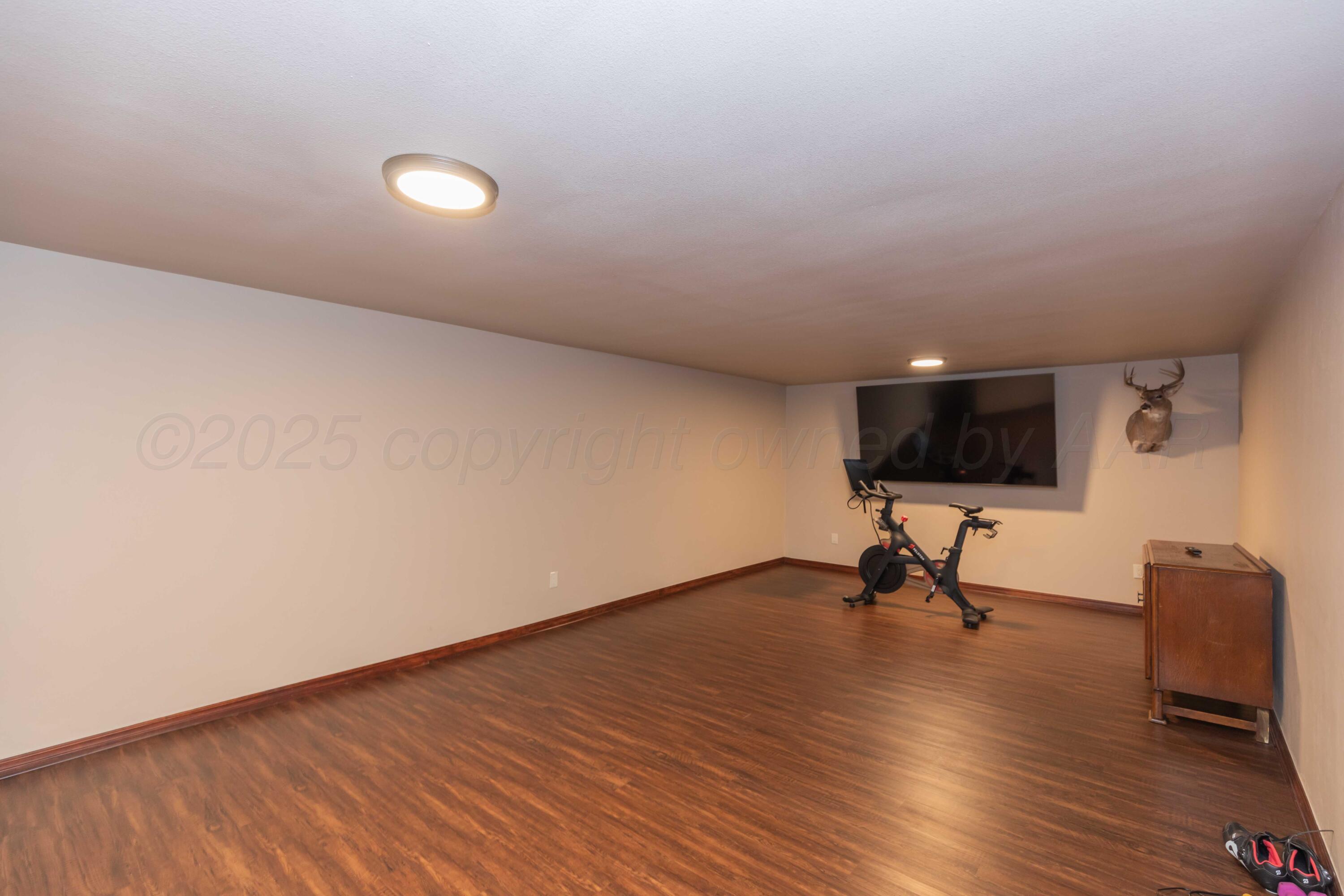 199 County Road BB Groom, TX 79039 - Photo 33 of 39 a view of an empty room with wooden floor and a window