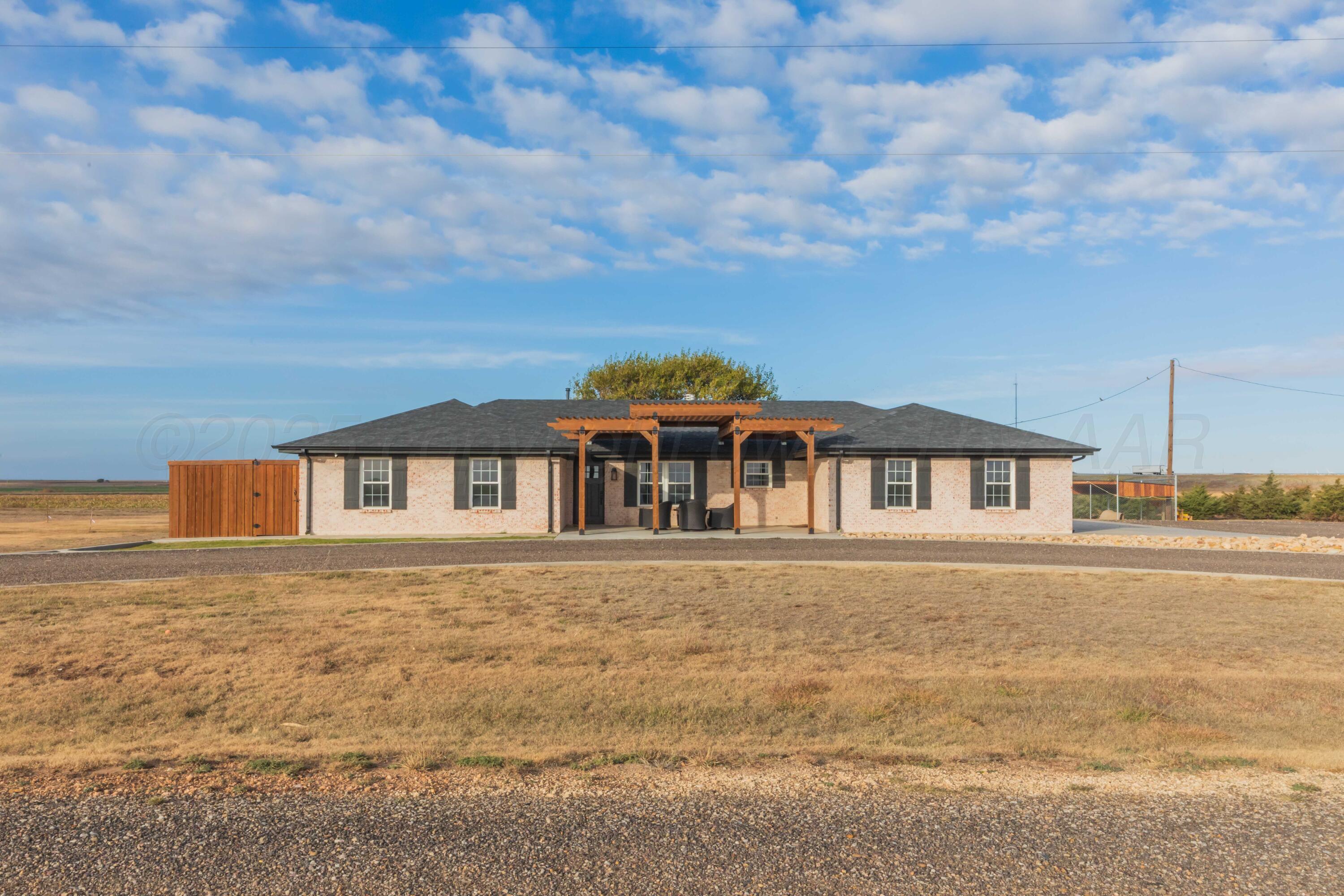 199 County Road BB Groom, TX 79039 - Photo 5 of 39 a front view of a house with a yard