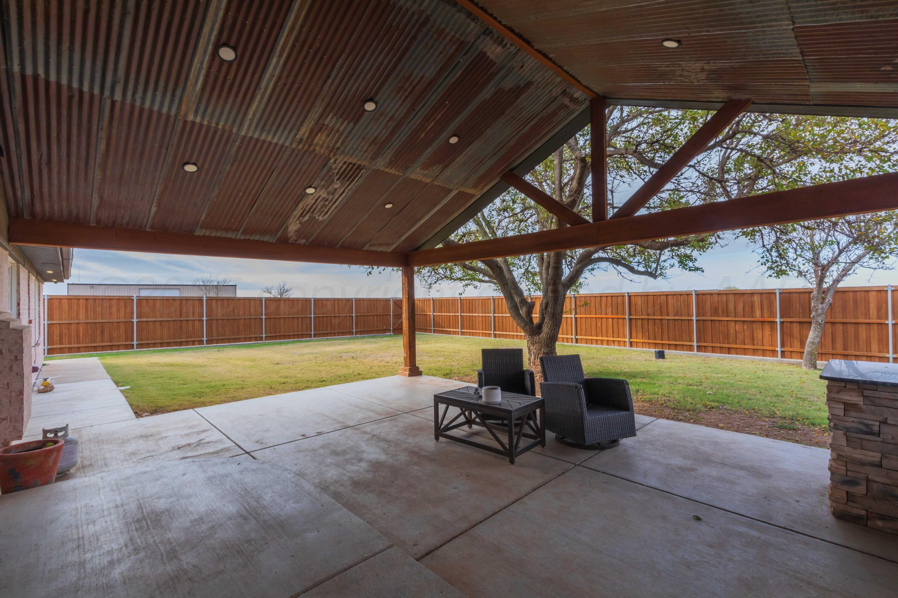 199 County Road BB Groom, TX 79039 - Photo 6 of 39 a view of backyard with seating space and trees