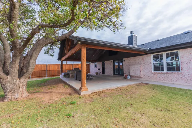 a kitchen with stainless steel appliances granite countertop a refrigerator stove and sink