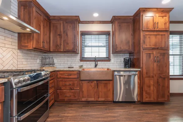 a kitchen with a sink and cabinets