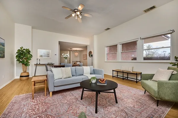 a living room with furniture and a rug