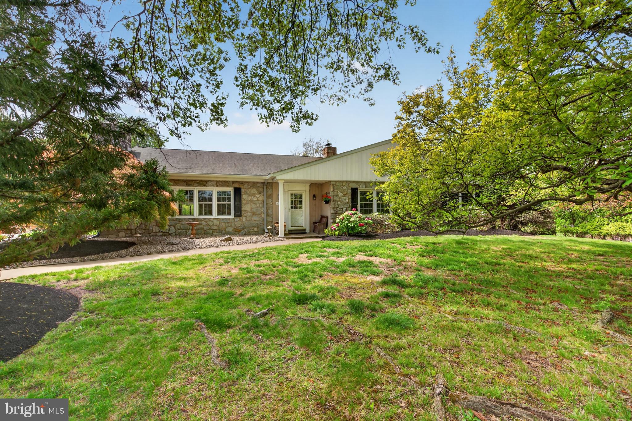300 Sanatoga Road Pottstown, PA 19465 - Photo 7 of 79 Charming home amidst lush greenery.