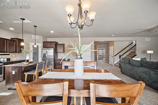 a view of a dining room with furniture