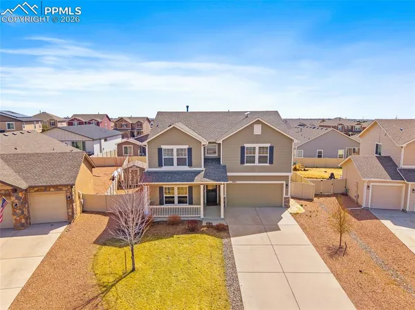 an aerial view of a house with a ocean view