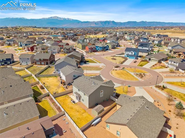 an aerial view of residential houses with outdoor space