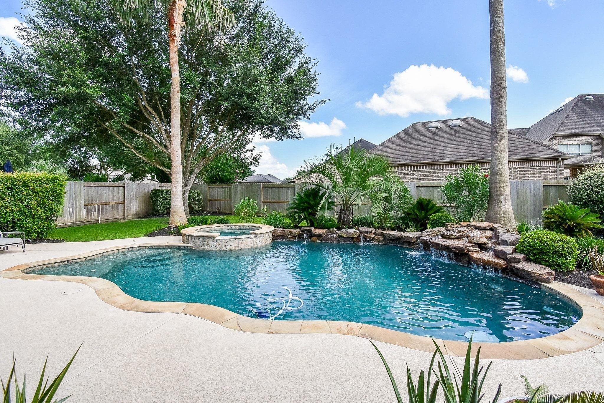 27607 Macklind Ridge Lane Katy, TX 77494 - Photo 12 of 50 Rock waterfall and raised spa.