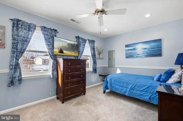 a living room with a bed and furniture