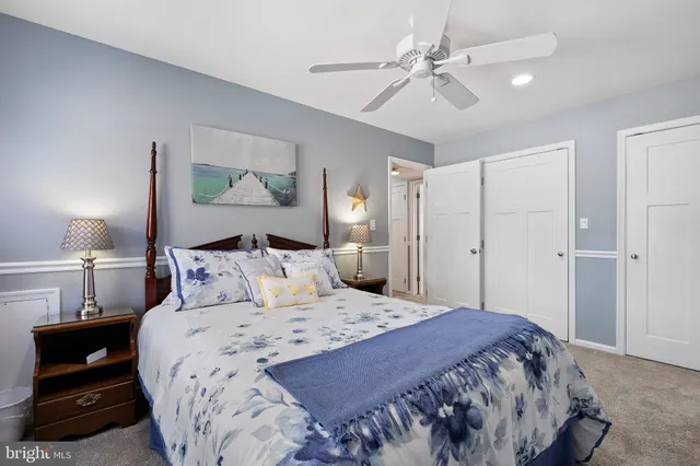 a bedroom with a bed and a lamp