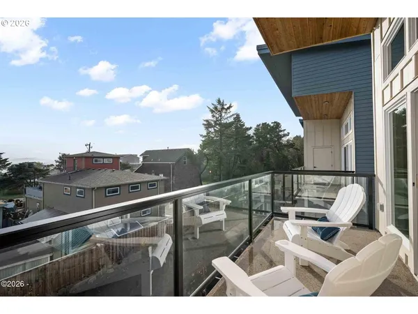 a view of balcony with furniture