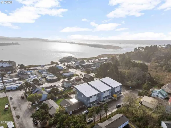 an aerial view of a city with ocean view