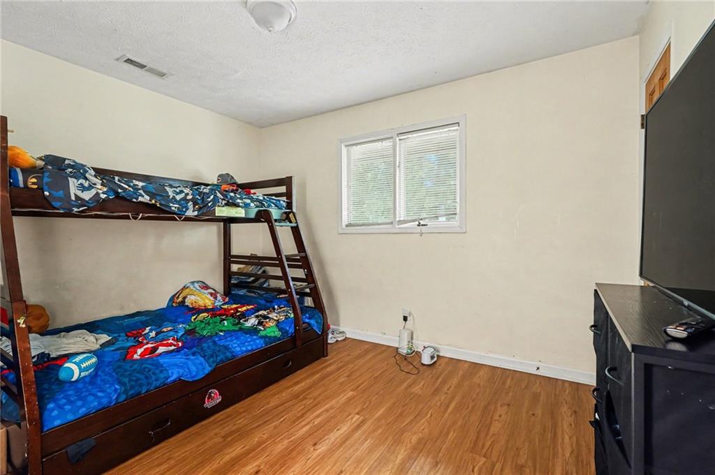 2530 Rockbridge Road Northwest Conyers, GA 30012 - Photo 17 of 45 a bed room with furniture and a window