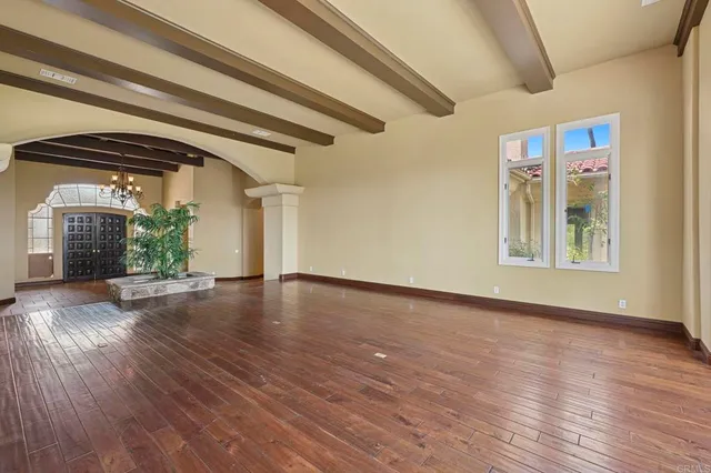 a view of an empty room with a cabinet