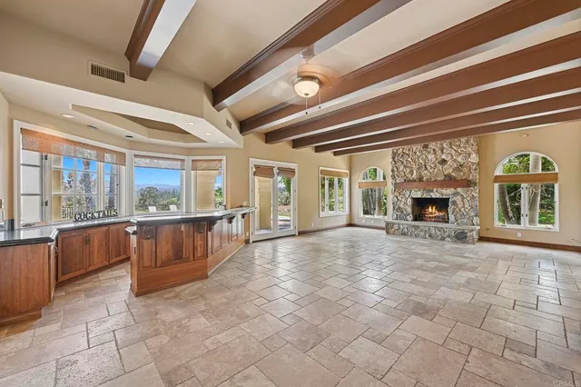 a kitchen with stainless steel appliances granite countertop a stove and a microwave