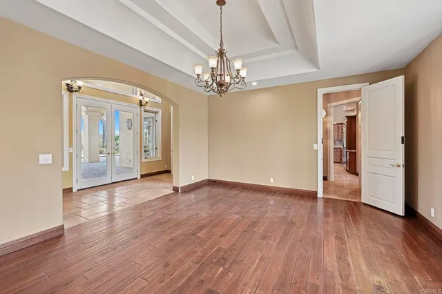 a kitchen with stainless steel appliances granite countertop a stove a sink dishwasher and a refrigerator