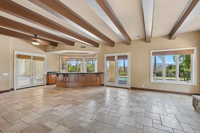 a view of a room with window and wooden floor