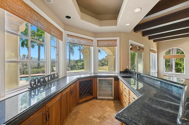 a spacious bedroom with a large bed couch and a window