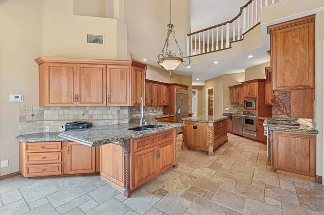 a view of a patio with a table and chairs