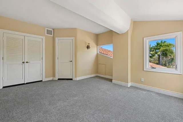 a bathroom with a granite countertop sink a toilet and shower