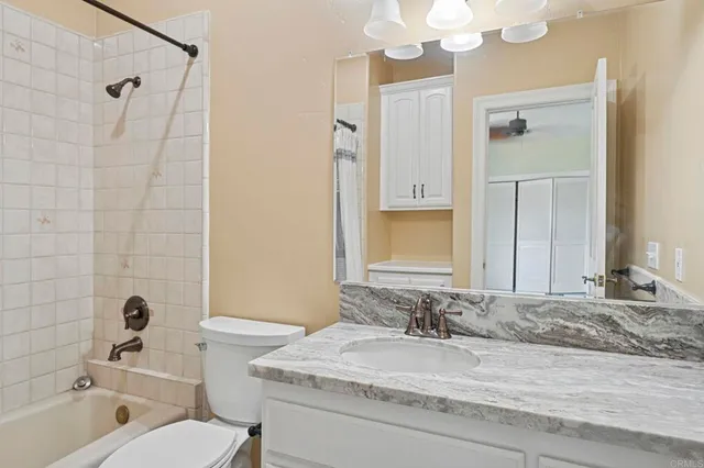 a view of a hallway view with three rooms